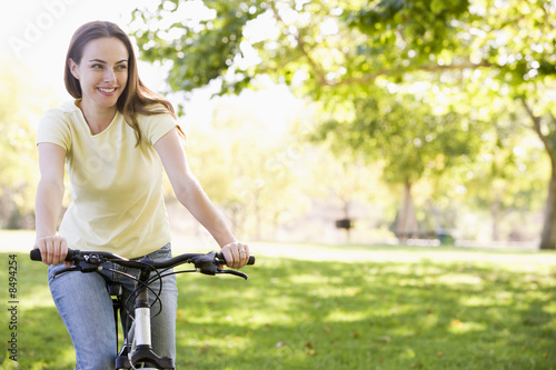 Woman on bicycle smiling