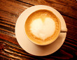 Coffee cup with milk and heart shape