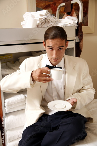 Photo: Hotel waiter taking a break Hotel waiter taking a break