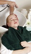 Young woman  having her hair  washed at a salon
