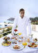 Waiter with breakfast table