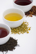 Three cups of tea in different colors with three different types