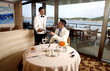 Waiter handing a man the menu in a restaurant
