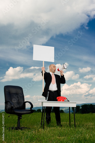 Photo: Business man with picket sign Business man with picket sign