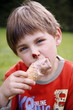 Young boy eating ice cream