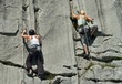 Two female rock climbers climbing limestone in Switzerland Two female rock climbers climbing limestone in Switzerland