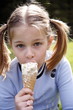 Young girl eating ice cream