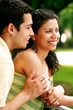 Young Couple Embracing & Talking Outside Young Couple Embracing & Talking Outside