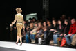 fashion model on podium from back