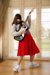 Teenage girl playing the guitar