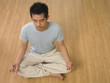 man pratising yoga at home