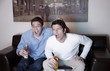 Two men watching a game on television