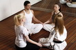 Participants in a fitness class meditating