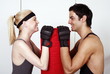 Young man and woman flirting in a fitness class