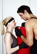Young man and woman flirting in a fitness class