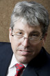 Businessman Lokking Over His Glasses