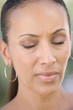 Head shot of woman scowling