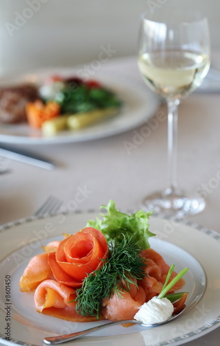 Photo: Smoked salmon dish on dinner table Smoked salmon dish on dinner table