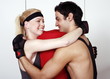 Young man and woman flirting in a fitness class