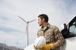 Engineer by car at wind farm