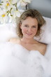 Mature woman enjoying bubble bath