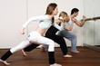 Students learning a basic Capoeira move
