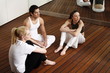 Participants waiting for the fitness class meditating