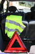 warning triangle and yellow waistcoat in the car