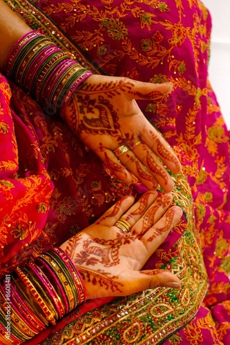 Indian wedding bride getting henna applied