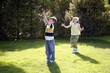 Boy and girl playing in the yard