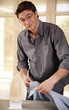 Man ironing shirt
