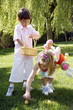 Boy and girl playing in the yard