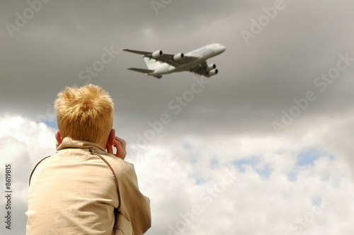 Photo: small child deafened by a low flying jet small child deafened by a low flying jet