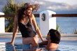 Couple at seaside swimming pool