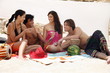 Two couples on beach having fun