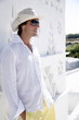 Young man in white shirt and hat