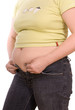 overweight lady attempting to fasten too small jeans