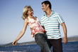 Photo: Mature adult couple on beach Mature adult couple on beach