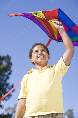 Photo: Young boy with kite outdoors smiling Young boy with kite outdoors smiling