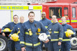 Photo: Portrait of a group of firefighters by a fire engine Portrait of a group of firefighters by a fire engine