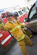 Firefighters cutting open a car to help an injured person