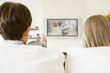 Photo: Young boy and young girl in living room with remote control and Young boy and young girl in living room with remote control and