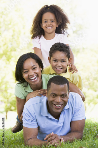 Photo: Family lying outdoors smiling Family lying outdoors smiling