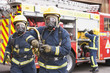Photo: Firefighters in protective workwear Firefighters in protective workwear