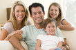 Family Sitting In Living Room ...