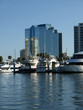 Luxury Glass Hotel with Yachts in Harbor Luxury Glass Hotel with Yachts in Harbor