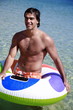 Man in the water with inflatable life ring