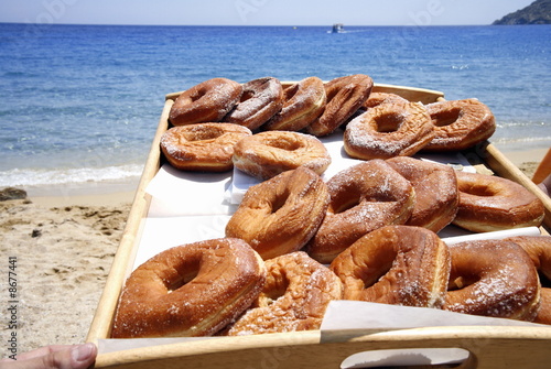 Photo: A tray of donuts on the beach A tray of donuts on the beach
