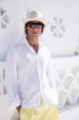 Young man in white shirt and hat