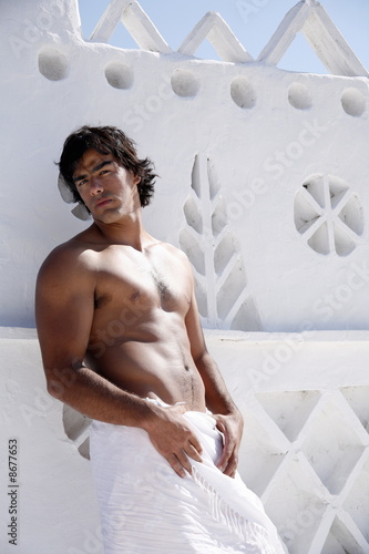 Photo: Young man wearing pareo Young man wearing pareo
